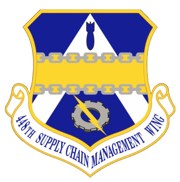 Logo der 48. Supply Chain Management Wing mit einem blauen Schild mit einem weißen Stern, einem weißen Banner mit der Aufschrift "Supply Chain Management" in Blau und dem Text "48. Supply Chain Management Wing" in fetter schwarzer Schrift.