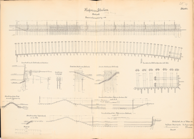 Offenes Buch mit detaillierten Zeichnungen und Text über ein Eisenbahnsystem, einschließlich einer Illustration der Eisenbahnschienen.