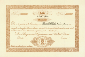 Altes Aktienzertifikat mit goldenem Rand, das ein Männerporträt und Text zeigt.